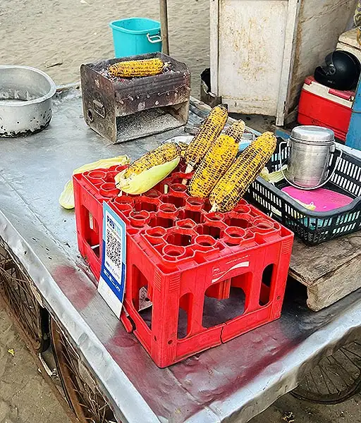 Roasted corn bhutta being sold at a food stall at Dumas Beach in Surat