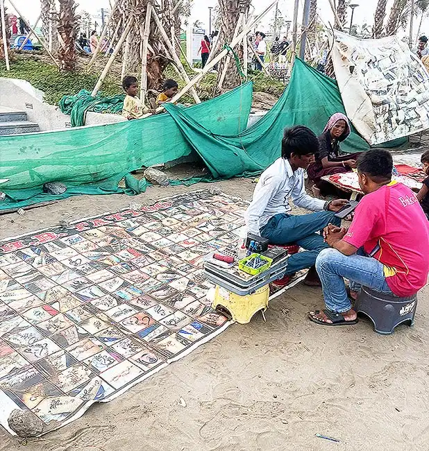 Tattoo stall with design sheets at Dumas Beach Surat