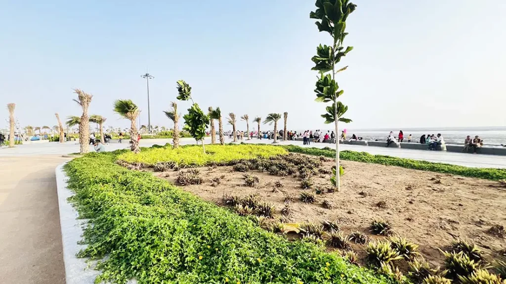 Green landscaped garden area at Dumas Sea Face Development Surat