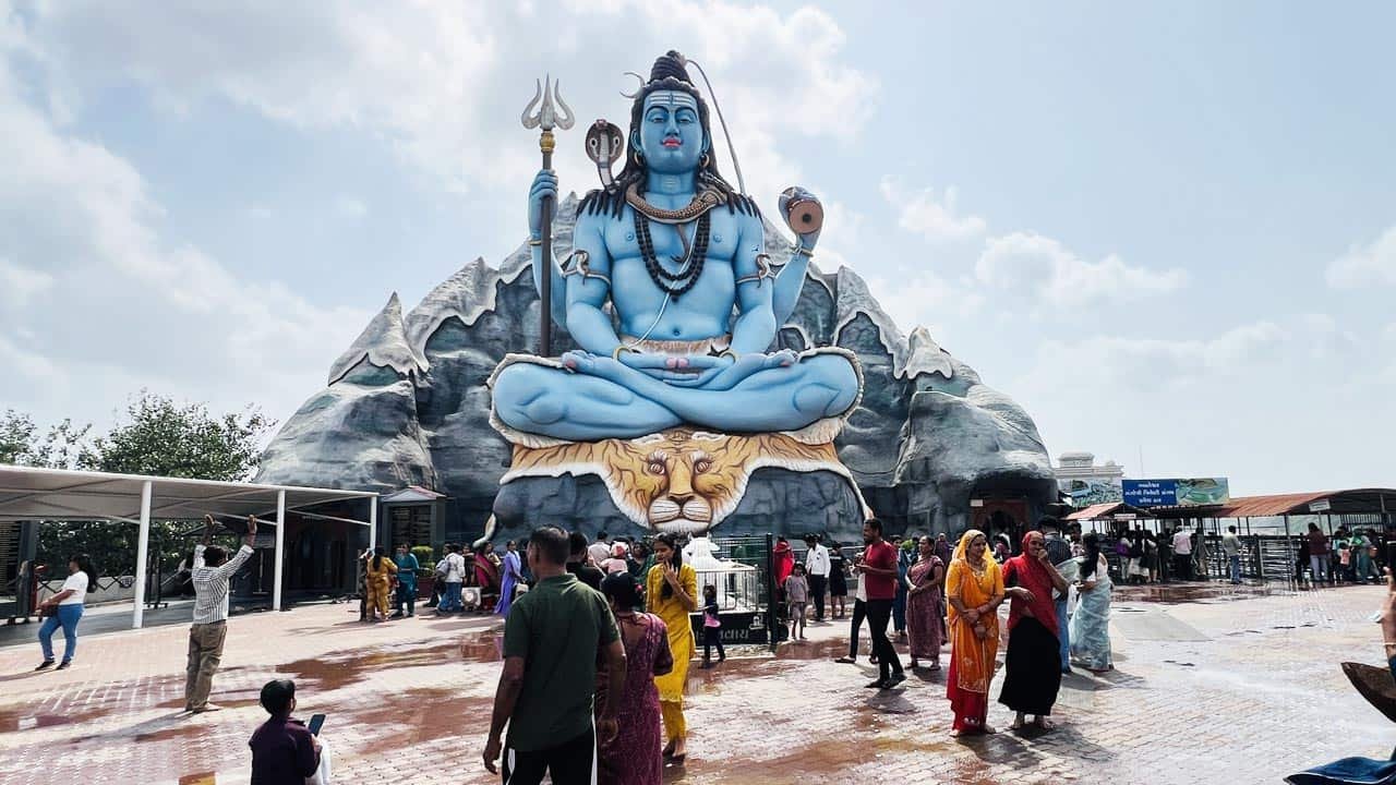Giant blue Lord Shiva statue seated on a tiger at Galteshwar Mahadev Temple near Surat