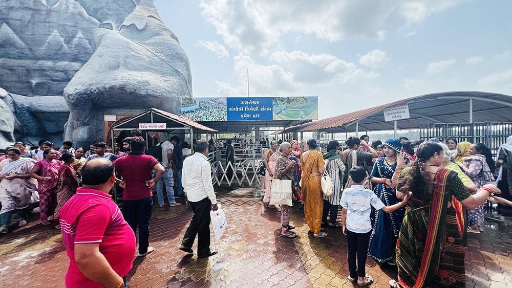 Crowd of devotees entering the Galteshwar Gangotri Triveni Sangam entrance gate