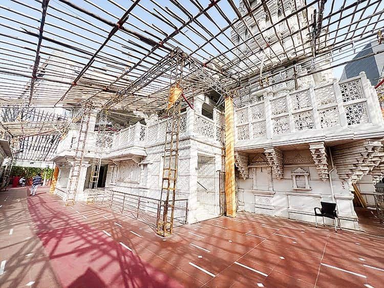 Back view of Shyam Baba Mandir Vesu Surat showing marble carving and scaffolding